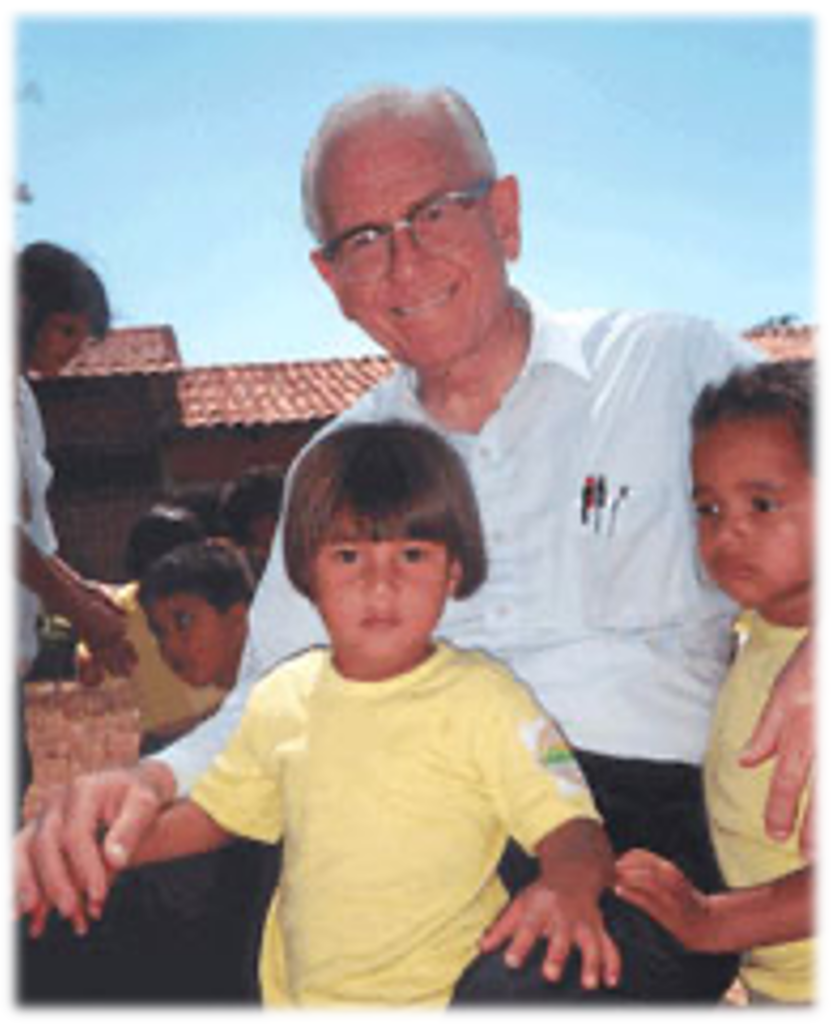 Father Wasson with two children
